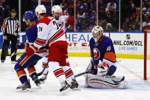 Carolina Hurricanes Brad Malone and Patrick Brown screen NY Islanders Goaltender Chad Johnson. (Brandon Titus/Inside Hockey)