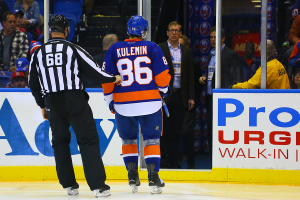 Nikolai Kulemin gets escorted off the ice following a game misconduct  (Brandon Titus/Inside Hockey)
