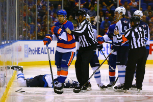 Nikolai Kulemin gets escorted away from Brad Stuart  after checking him into the boards. (Brandon Titus/Inside Hockey)