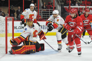 10 Nov 2014 Calgary Flames Goalie Jonas Hiller (1) [6070] tries to find the puck in mid-air during the third period of the game between the Calgary Flames and the Carolina Hurricanes at the PNC Arena in Raleigh, NC. Carolina defeated Calgary 4-1.