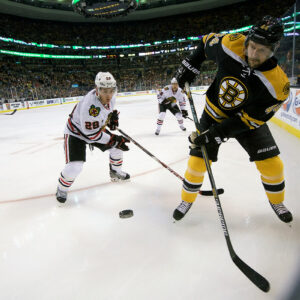 Boston Bruins defenseman Dennis Seidenberg (44) clears the puck out of the corners.