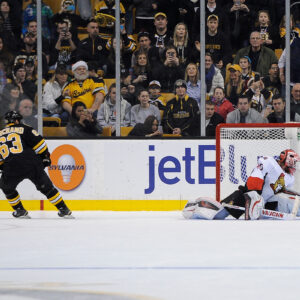 Dec 13, 2014; Boston Bruins left wing Brad Marchand (63) scores on Ottawa Senators goalie Robin Lehner (40) during the shootoutin a NHL game in the TD Garden in Boston. (Photo: Brian Fluharty)