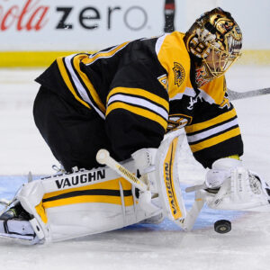 Boston Bruins goalie Tuukka Rask (40) covers the puck.