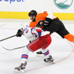 NHL 2015 - Sept 22 - NYR vs PHI - Right Wing Colin McDonald (#36) of the Philadelphia Flyers shoots the puck against Defenseman Ryan Graves (#58) of the New York Rangers