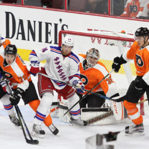 NHL 2015 - Sept 22 - NYR vs PHI - Members of the New York Rangers and Philadelphia Flyers battle in front of the net
