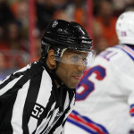 NHL 2015 - Sept 22 - NYR vs PHI - Linesman Shandor Slphonso (#52) waits for the end of a television commercial break