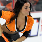 NHL 2015 - Sept 22 - NYR vs PHI - A Flyers Ice Girl clears off the ice during a television commercial time-out