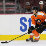 NHL 2015 - Sept 22 - NYR vs PHI - Center Travis Konecny (#80) of the Philadelphia Flyers settles the puck