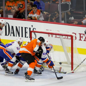 Center Mikhail Vorobyev (#46) of the Philadelphia Flyers sends the puck through the crease