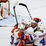 Members of the New York Islanders celebrate a goal scored
