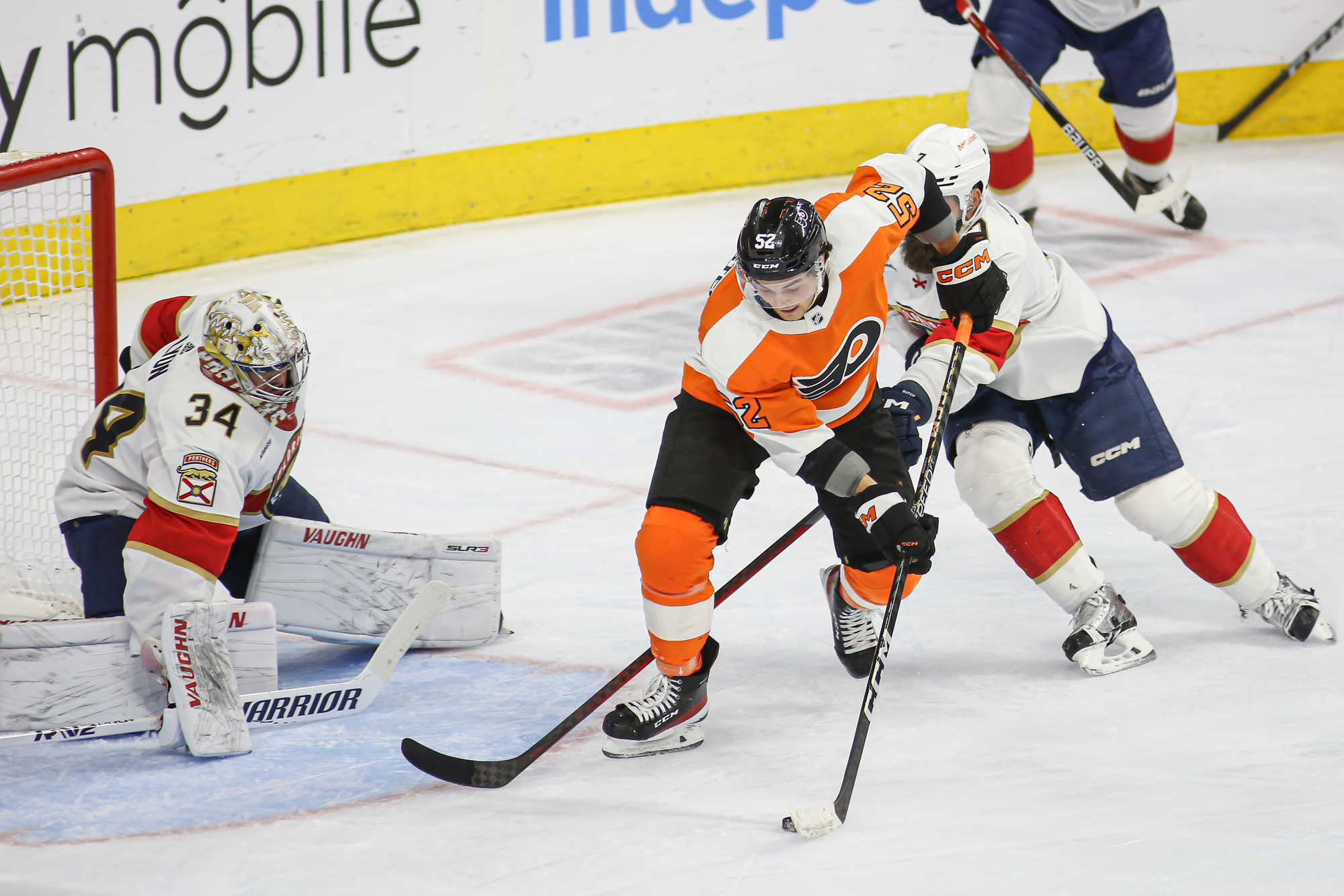 Tyson Foerster of the Philadelphia Flyers is hit into the boards